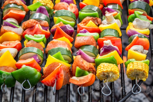 Preview: Homemade skewers on grill with vegetables and meat