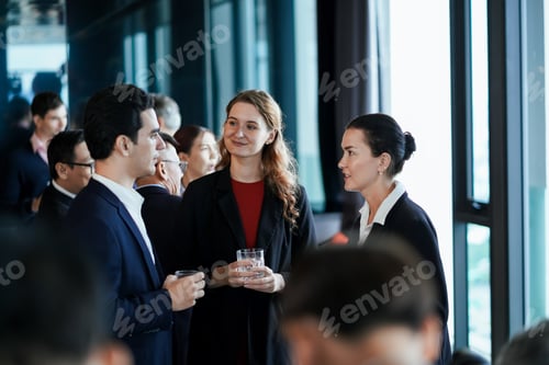 Preview: A group of people are standing in a room, some of them are wearing suits