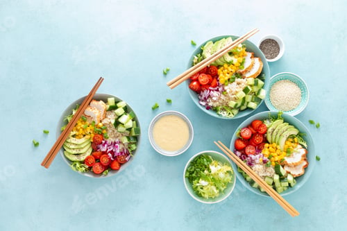 Preview: Lunch bowls with grilled cgicken meat, rice and fresh salad of avocado, cucumbers, corn