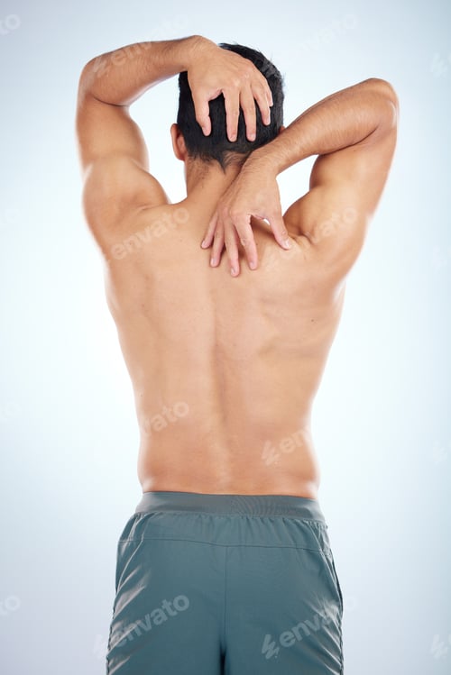 Preview: Man, body or stretching back muscles on blue background in studio pain relief, healthcare wellness