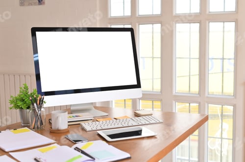 Preview: Creative table with Mockup computer and office supplies on wooden desk.