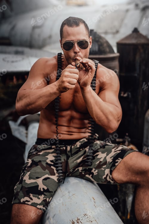 Preview: Naked man with cigar sitting near abandoned airplane