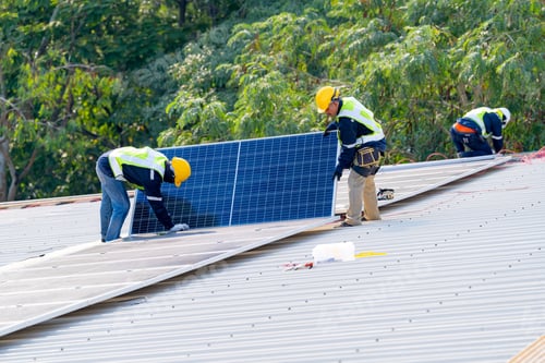 Preview: workers installing solar panels, for efficient energy on rooftop