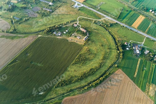 Preview: Aerial landscape view of green and yellow cultivated agricultural fields with growing crops