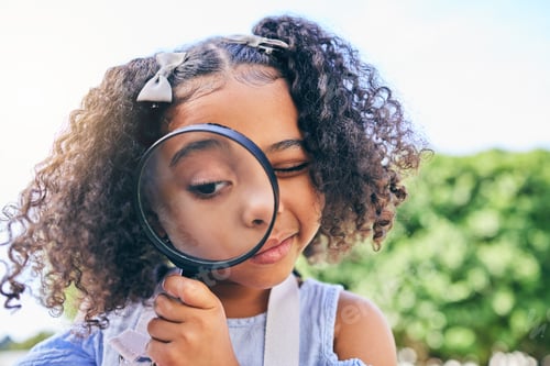 Preview: Girl child, magnifying glass and inspection in garden, backyard or park in science, study or outdoo