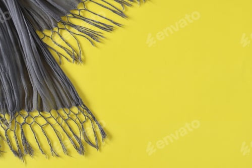 Preview: Dark gray scarf with a fringe on a bright yellow background - trending colors