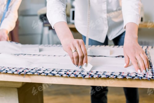 Preview: Close-up photo of women's hands of dressmaker