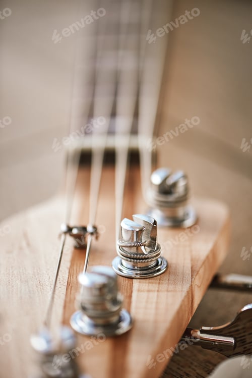 Preview: Close-up photo of guitar headstock with keys for adjusting guitar strings