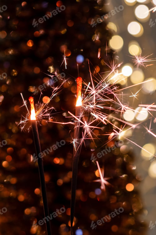 Preview: Christmas bengal fire sparkles against the black background.