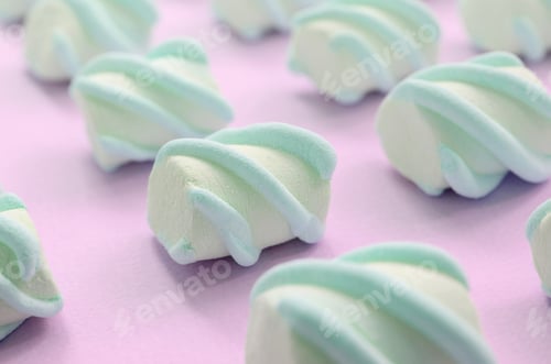 Preview: Colorful marshmallow laid out on pink paper background