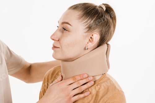 Preview: Cervical collar fitted to young woman for neck injury treatment
