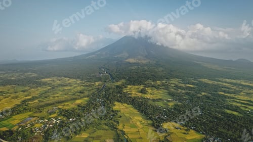 Preview: Mayon volcano erupts at Philippines countryside aerial. Tropic green forest plants and grasses