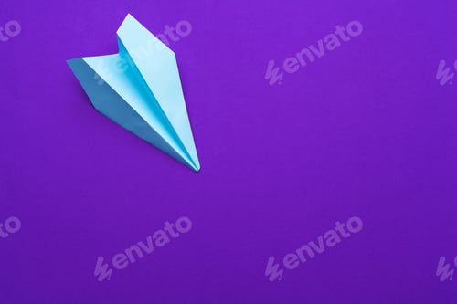 Preview: white paper airplane on a purple background