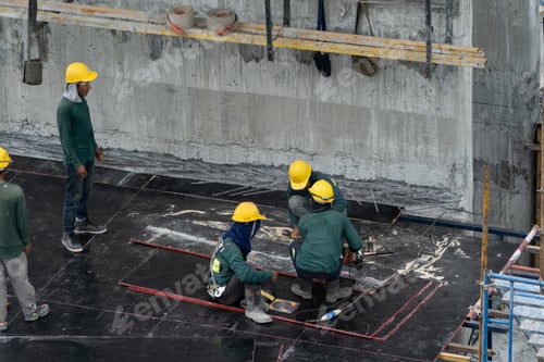 Preview: Aerial view of busy industrial construction site workers working. Development high rise building.