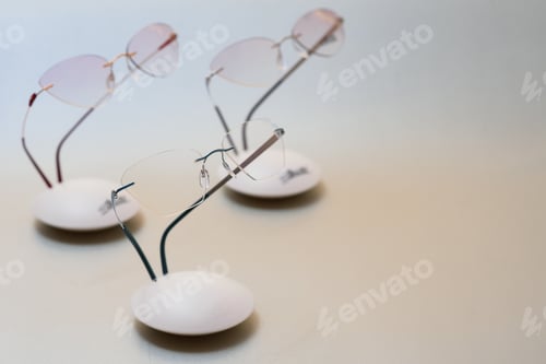 Preview: Stylish eyeglasses. Modern eyeglass frames on a colored background