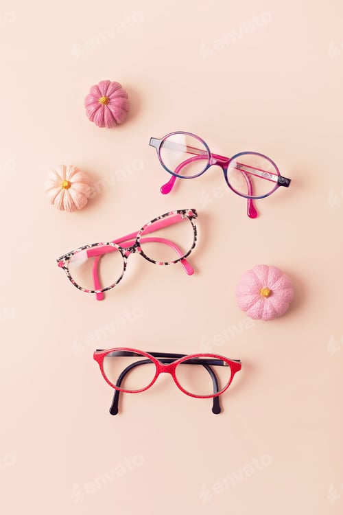 Preview: Child eyeglasses over pink pastel background