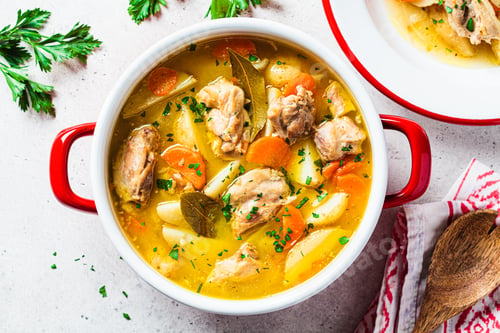 Preview: Chicken stew with potatoes and carrots in red saucepan