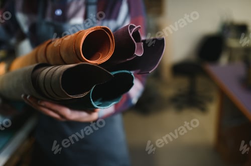Preview: work in leather shop on dark background