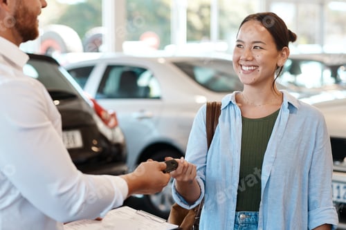 Preview: Are you ready to find your car. Shot of a car salesman handing over keys to a customer.