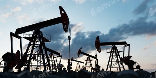 Preview: Oil pumps at sunset in a vast oil field. Oil industry