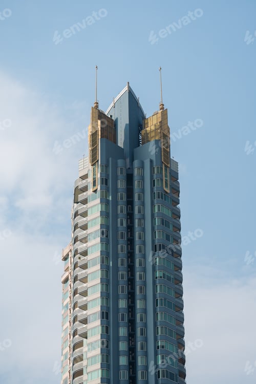 Preview: Unique Architectural Skyscraper Against Blue Sky.