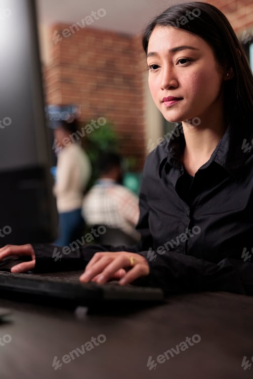 Preview: Asian system administrator upgrading firewall system in order to maintain security stability