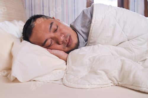 Preview: Close up man sleeping on the bed with white blanket