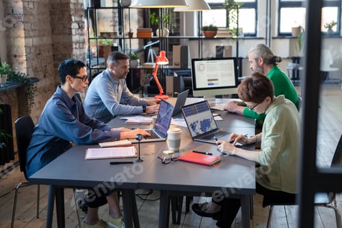 Preview: Business people using computers at work