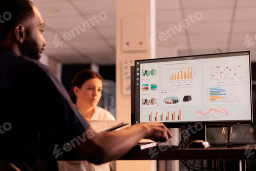 Preview: Project manager analyzing business research results on computer screen