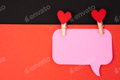 Preview: Note And wooden clothespins red heart Valentine's day and red sheet of paper isolated background