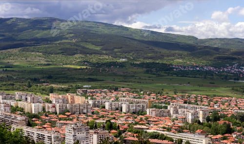 Preview: View from above to the city and mountain, cloudy sky