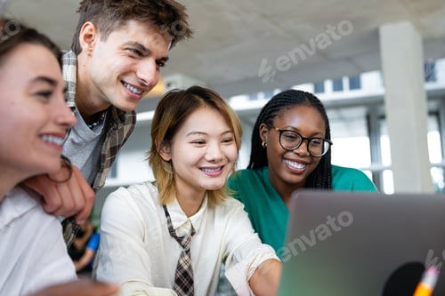 Preview: A diverse group of individuals is collaborating enthusiastically on a laptop in a modern workspace