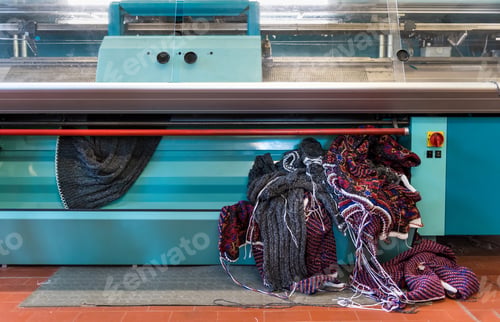 Preview: Knitted fabric coming out of a commercial knitting machine