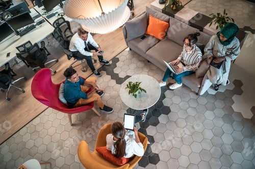 Preview: Top view photo of Multiethnic startup business team having brainstorming in relaxation area of