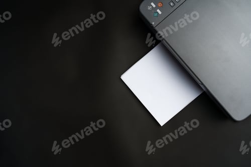 Preview: Modern laser printer on black background close up