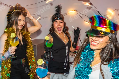 Preview: Festive Young Women Celebrate with Drinks and Party