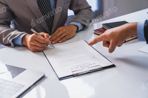 Preview: employer interviewing for a job or head of HR is reading a resume while discussing the job applicant