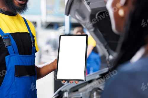 Preview: Garage employee holds mockup device
