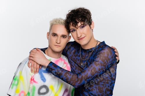Preview: smiling nonbinary person embracing gay man isolated on grey