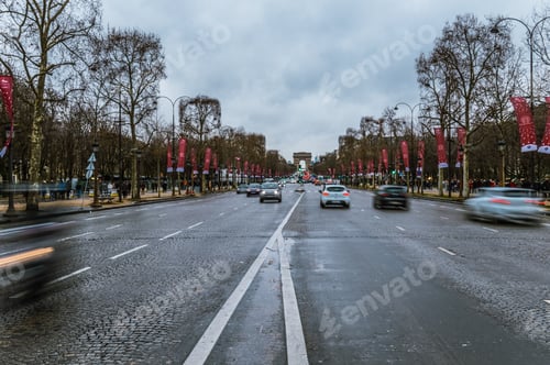 Preview: The road on the Champs-Elysees with a view of the Arc de Triomphe