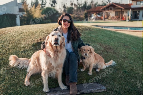 Preview: Woman with her Golden Retrievers in Backyard