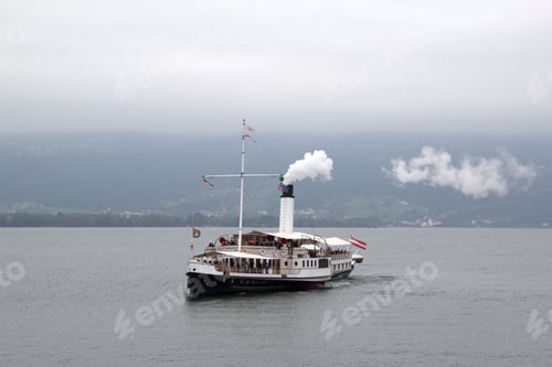 Preview: View on an old steamboat on the Lake Bodensee, Germany on a cloudy day background