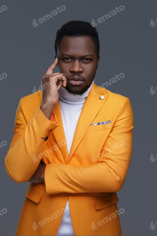 Preview: Pensive african guy with his finger to his head