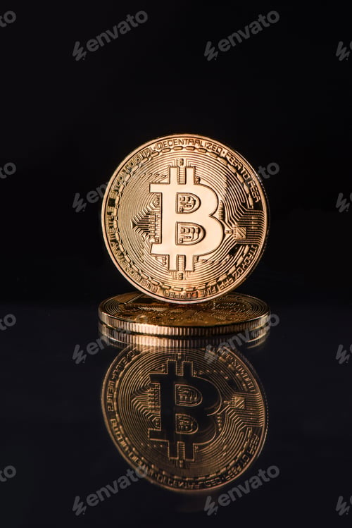 Preview: Close up view of golden bitcoins isolated on black