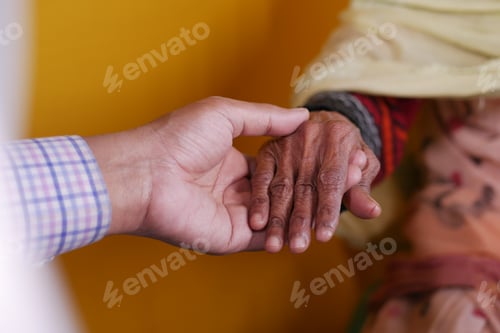 Preview: doctor holding hand of a senior women