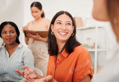 Preview: Confident young hispanic business woman speaking to colleagues during a meeting in an office boardr