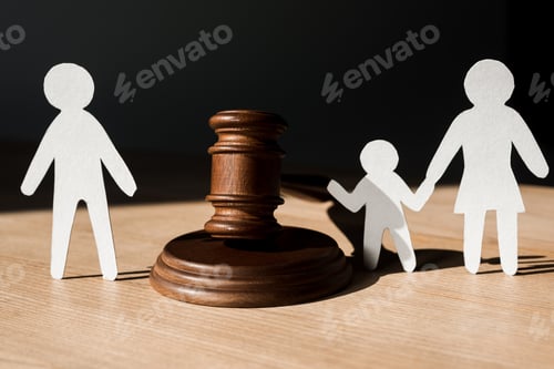 Preview: paper people near wooden gavel on black, divorce concept