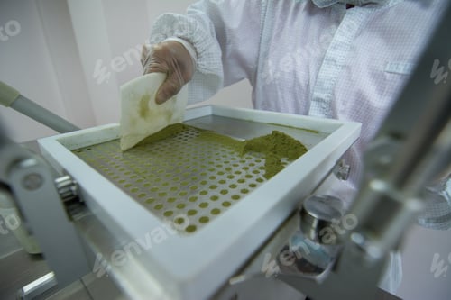 Preview: Closeup shot of medical pills in the production line
