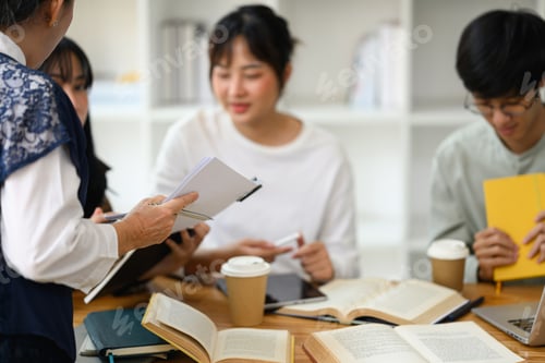 Preview: Cropped shot of middle age professor explaining lesson to students during a class
