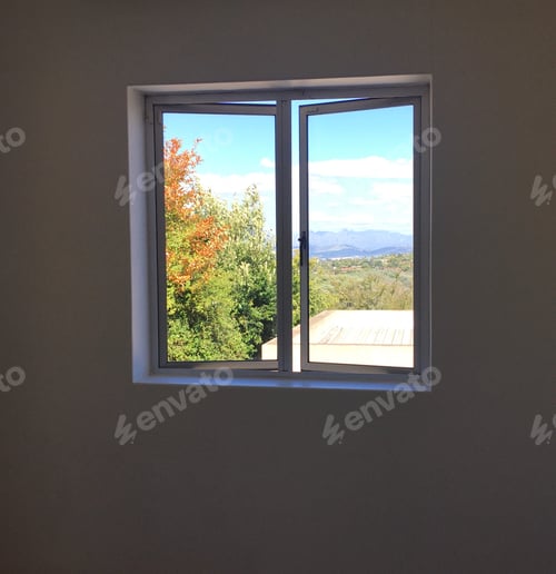 Preview: Vow through a window of a tree and mountains in the background